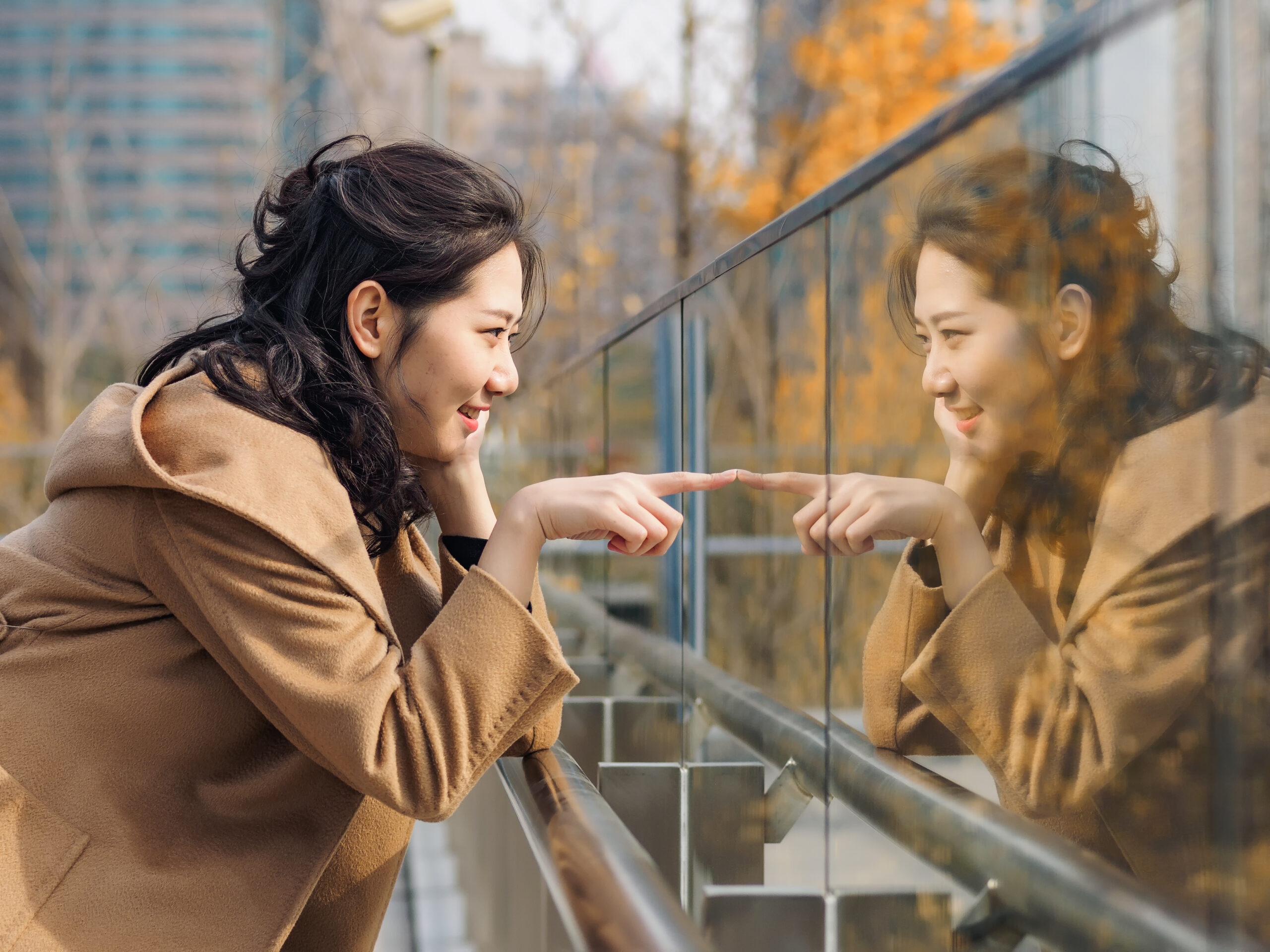 woman looking in mirror